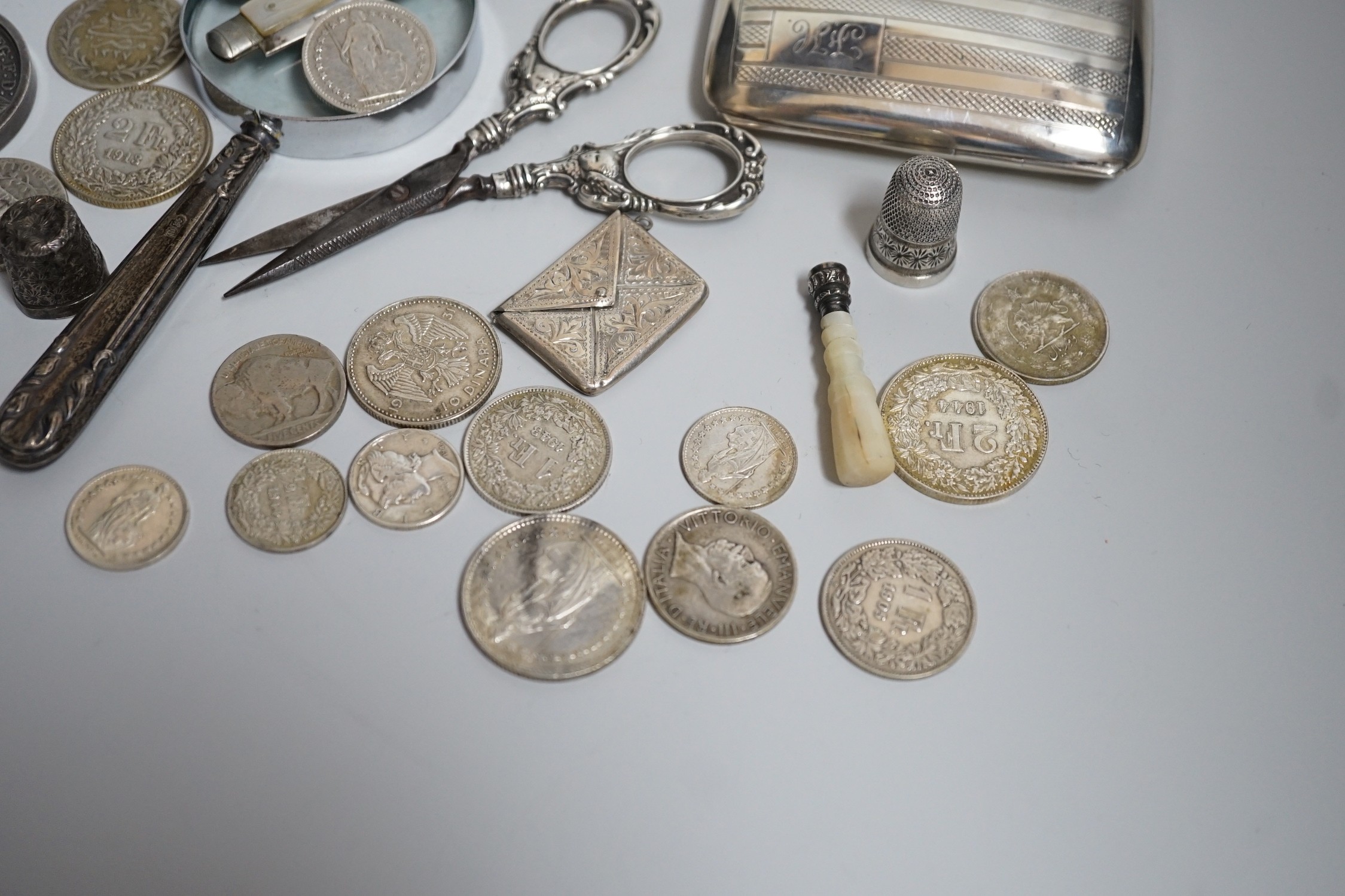Miscellaneous small silver and white metal items including thimbles, a cigarette case, envelope stamp case, fruit knife, seal, etc and a group of assorted coinage including a silver crown in pendant mount.